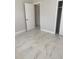 Well-lit bedroom with tile floors and ample closet space at 118 5Th Jpv St, Winter Haven, FL 33880