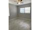 Bright bedroom with tile floors and window coverings at 118 5Th Jpv St, Winter Haven, FL 33880