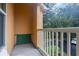 Small balcony with a view of the parking lot and surrounding landscape at 8830 Villa View Cir # 204, Orlando, FL 32821