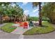 Relaxing community patio with colorful seating and picnic tables at 8830 Villa View Cir # 204, Orlando, FL 32821