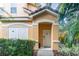 Inviting condo exterior with lush landscaping and a private entrance at 8830 Villa View Cir # 204, Orlando, FL 32821