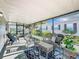 Relaxing screened porch with wicker furniture at 1622 Tally Ho Dr, Lakeland, FL 33810