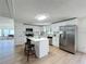 Bright kitchen with island, stainless steel appliances, and white cabinetry at 1622 Tally Ho Dr, Lakeland, FL 33810