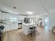 Modern kitchen with white cabinets, quartz countertops, and stainless steel appliances at 1622 Tally Ho Dr, Lakeland, FL 33810