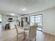 Kitchen views, glass table, and seating for four in the dining area at 1622 Tally Ho Dr, Lakeland, FL 33810