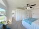 Main bedroom with large windows, walk-in closet, and bathroom access at 1622 Tally Ho Dr, Lakeland, FL 33810