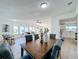 Open dining area with wood table and chairs, adjacent to living room at 1622 Tally Ho Dr, Lakeland, FL 33810