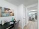Home office with a desk and view into the kitchen at 1622 Tally Ho Dr, Lakeland, FL 33810