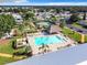 Aerial view of community pool with people enjoying the sunshine at 1622 Tally Ho Dr, Lakeland, FL 33810
