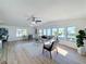 Open living area with large windows, hardwood floors, and comfortable seating at 1622 Tally Ho Dr, Lakeland, FL 33810