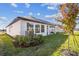 Side view of house showcasing landscaping and AC unit at 16971 Cedar Valley Cir, Clermont, FL 34711