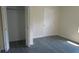Bedroom with large closet and gray flooring at 3225 Oakland N Rd, Lakeland, FL 33801