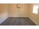 Dining room with modern light fixture and grey vinyl flooring at 3225 Oakland N Rd, Lakeland, FL 33801