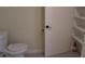Bathroom with toilet, linen closet, and shelving at 3225 Oakland N Rd, Lakeland, FL 33801