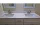 Double vanity bathroom with white cabinets and quartz countertop at 3225 Oakland N Rd, Lakeland, FL 33801