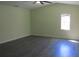 Spacious bedroom with gray laminate flooring at 3225 Oakland N Rd, Lakeland, FL 33801