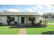 Front view of a charming white brick home at 3225 Oakland N Rd, Lakeland, FL 33801