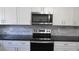 Modern kitchen with stainless steel range and microwave at 3225 Oakland N Rd, Lakeland, FL 33801