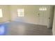 Bright living room with gray laminate floors at 3225 Oakland N Rd, Lakeland, FL 33801