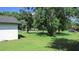 Large backyard with mature trees and grassy area at 3225 Oakland N Rd, Lakeland, FL 33801