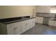 Kitchen with white cabinets and granite countertops at 3225 Oakland N Rd, Lakeland, FL 33801