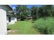 Large backyard with mature trees and grassy area at 3225 Oakland N Rd, Lakeland, FL 33801