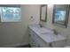 Double vanity bathroom with quartz countertop and updated fixtures at 3225 Oakland N Rd, Lakeland, FL 33801