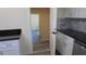 Modern kitchen features granite countertops and white cabinets at 3225 Oakland N Rd, Lakeland, FL 33801