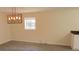 Dining room with modern light fixture and grey vinyl flooring at 3225 Oakland N Rd, Lakeland, FL 33801