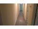 Long hallway with gray laminate flooring at 3225 Oakland N Rd, Lakeland, FL 33801
