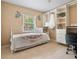 Bedroom with full-size bed, walk-in closet, and built-in shelves at 105 Hainesport Dr, Lake Alfred, FL 33850