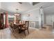 Bright dining room with hardwood floors, a large table, and access to the backyard at 105 Hainesport Dr, Lake Alfred, FL 33850