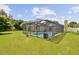 Relaxing screened pool area perfect for outdoor entertaining at 105 Hainesport Dr, Lake Alfred, FL 33850