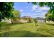 Spacious backyard with a shed and mature trees at 105 Hainesport Dr, Lake Alfred, FL 33850