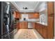 Modern kitchen with stainless steel appliances and light wood cabinets at 105 Hainesport Dr, Lake Alfred, FL 33850