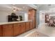 Updated kitchen featuring light wood cabinets, granite countertops, and a breakfast bar at 105 Hainesport Dr, Lake Alfred, FL 33850