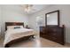 Bedroom with a queen bed, dresser, and large mirror at 105 Hainesport Dr, Lake Alfred, FL 33850