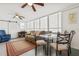 Sunroom with seating area, dining table, and large windows at 6505 Raintree Ne Ln, Winter Haven, FL 33881