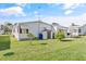 Side view of a white single-wide mobile home at 6505 Raintree Ne Ln, Winter Haven, FL 33881