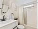 Clean bathroom with white vanity, tub, and shower at 6505 Raintree Ne Ln, Winter Haven, FL 33881