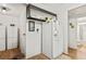 Kitchen area with refrigerator and additional storage at 6505 Raintree Ne Ln, Winter Haven, FL 33881