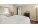 Bedroom with a full-size bed, dresser, and mirrored closet at 6505 Raintree Ne Ln, Winter Haven, FL 33881