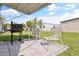 Relaxing backyard patio with grill and seating at 6505 Raintree Ne Ln, Winter Haven, FL 33881