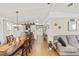 Open concept living and dining room with hardwood floors at 6505 Raintree Ne Ln, Winter Haven, FL 33881