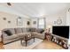 Spacious living room with large sectional sofa and wood coffee table at 6505 Raintree Ne Ln, Winter Haven, FL 33881