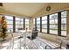 Sunroom with table and chairs and a view of the community at 6505 Raintree Ne Ln, Winter Haven, FL 33881