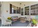 Front porch of a manufactured home with seating and fall decor at 6505 Raintree Ne Ln, Winter Haven, FL 33881