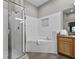 Clean bathroom with walk-in shower and a relaxing bathtub at 3050 Pirates Retreat Ct # 502, Kissimmee, FL 34747