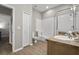 Simple bathroom with a tub, toilet and vanity at 3050 Pirates Retreat Ct # 502, Kissimmee, FL 34747
