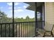 Relaxing screened balcony overlooking lush green landscape at 3050 Pirates Retreat Ct # 502, Kissimmee, FL 34747